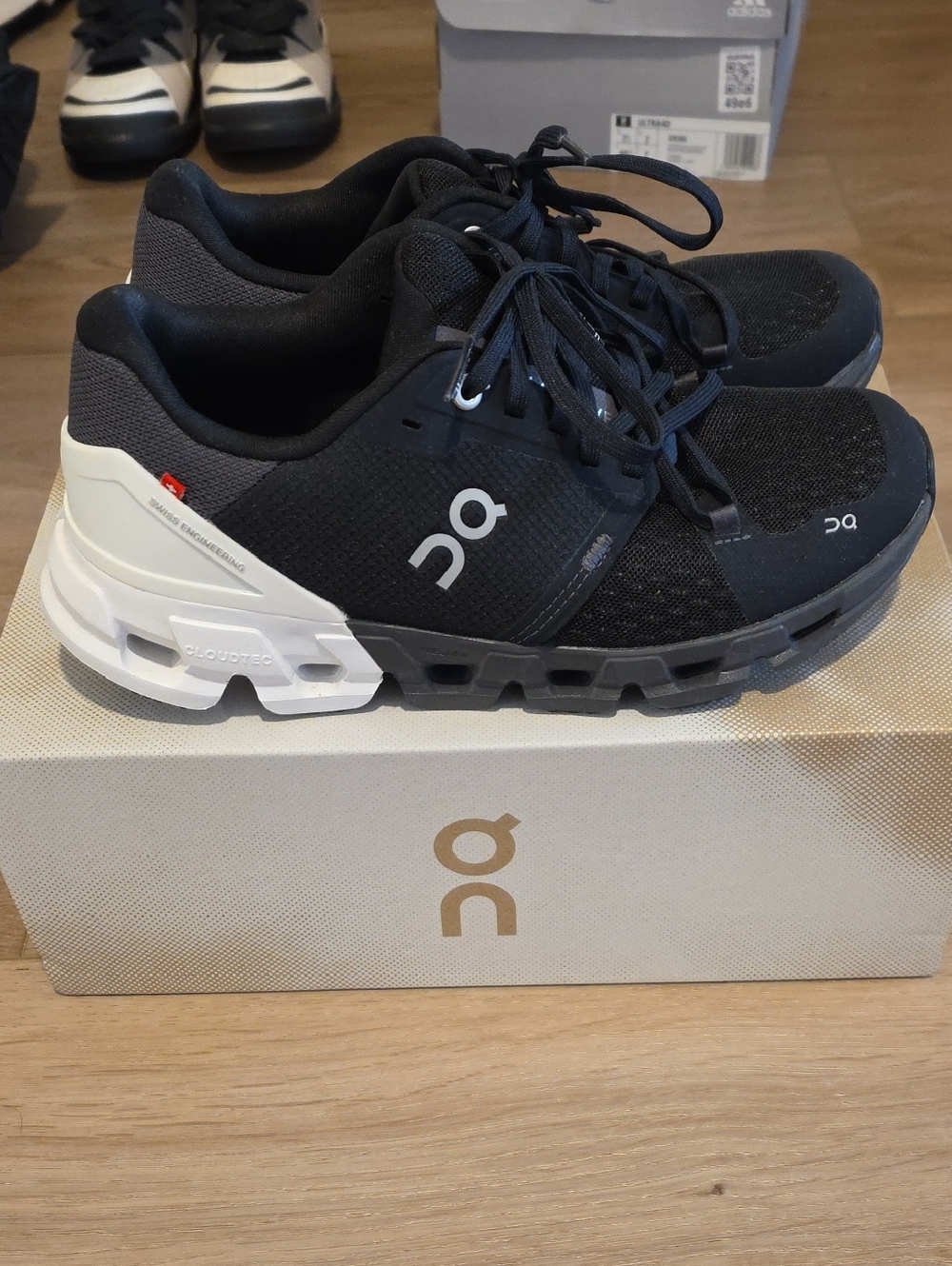 On Cloudflyer 4 Men's Black and White Cloud Running Shoes